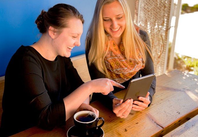 Services-SocialMedia-692-479-1 two young women looking at social media in Bozeman, MT