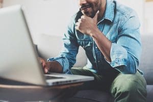 man looking at laptop